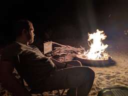 Jan-Erik sitting by the campfire